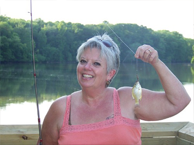 During their vacation on the Roanoke River fishing for monster Blue Catfish, Linda and her husband, Donald, enjoyed a memorable moment as she hooked a Brim Fish.